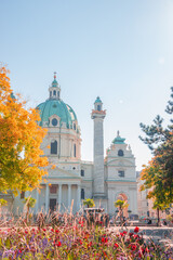Front view of Saint Karl Cathedral (Karlskirche) in Vienna at Autumn colors, Austria, at direct front sunlight, sunny
