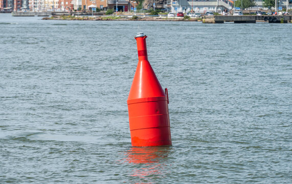 Red navigational bouy showing where to pass.