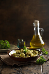 Homemade potato gnocchi with parsley pesto and bread crumbs