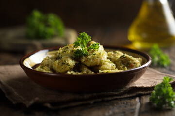 Homemade potato gnocchi with parsley pesto and bread crumbs