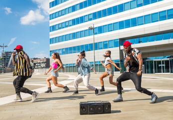 Hip hop crew dancing outdoors
