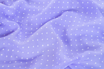 violet polka dots silk background texture top view