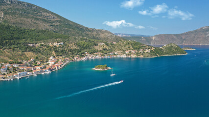 Fototapeta premium Aerial drone panoramic photo of picturesque village capital and port of Ithaki or Ithaca island called Vathi a safe anchoring for sail boats, Ionian, Greece