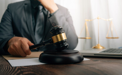 Business and lawyers discussing contract papers with brass scale on desk in office. Law, legal...