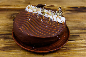 Tasty chocolate cake on a wooden table