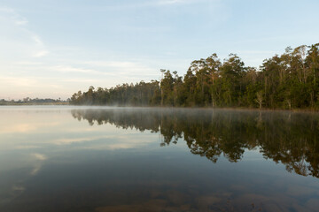 Fototapeta na wymiar Beautiful nature and fog on the reservoir in Khao Yai National Park Thailand 