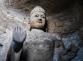 Seated statue of Amitabha Buddha in Cave 3 at Yungang Grottoes, Datong, Shanxi, China. Created from 5th century during Northern Wei period. UNESCO World Heritage.