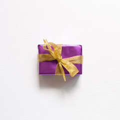 Purple gift box isolated on white background. top view