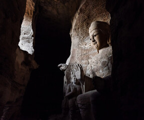 Seated statue of Amitabha Buddha in Cave 3 at Yungang Grottoes, Datong, Shanxi, China. Created from 5th century during Northern Wei period. UNESCO World Heritage.