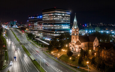 Fototapeta na wymiar Katowice nocą - Panorama miasto wieczorem - praca w biurze nocą 