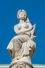Fototapeta na wymiar Statues of beautiful women as musicians and singers of State Opera fountain in Vienna, Austria, details, closeup