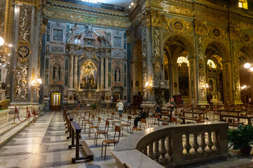 Fototapeta na wymiar Chiavari, Italy - June, 28 2020: Interior of the Cathedral Basilica of Our Lady of the Garden with quota measures during the coronavirus pandemic