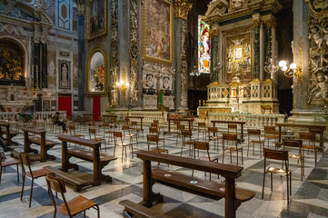 Fototapeta na wymiar Chiavari, Italy - June, 28 2020: Interior of the Cathedral Basilica of Our Lady of the Garden with quota measures during the coronavirus pandemic