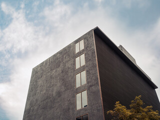 abstract modern architecture with dramatic sky in background.