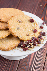 Oat cookies served on wooden table close up