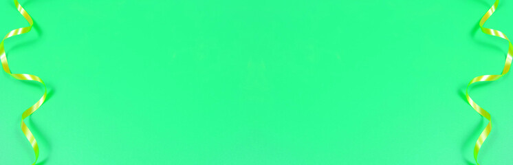 green background with place for text and golden ribbons along the borders, banner