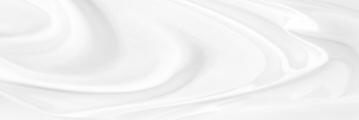 White gray satin texture that is white silver fabric silk panorama background with beautiful soft blur pattern natural.