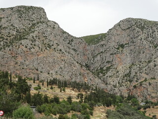 Fototapeta na wymiar Landscape of ancient sanctuary Delphi, also called Python in Greece. The? ancient Greeks?considered the centre of the world is in Delphi, marked by the stone monument known as?the omphalos.