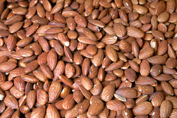 Almonds as a very effective and beautiful background of natural products.
