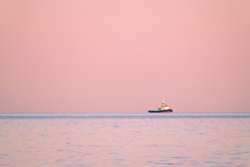 Tugboat on sunset