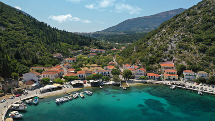 Fototapeta na wymiar Aerial drone photo of picturesque small fishing village of Frikes a safe anchorage for sail boats and yachts in island of Ithaki or Ithaca, Ionian, Greece