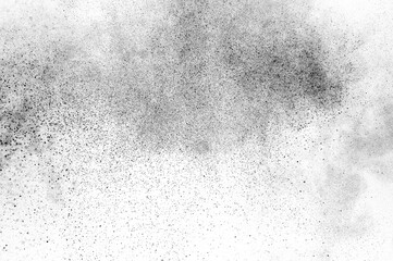 Black particles explosion isolated on white background.  Abstract dust overlay texture.
