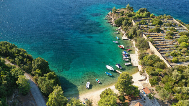 Aerial drone photo of secluded paradise sandy bay a safe anchorage for sail boats and yachts with turquoise bay, Ithaki or Ithaca island, Ionian, Greece