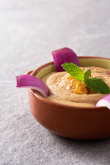 Gofio escaldado in bowl on gray stone