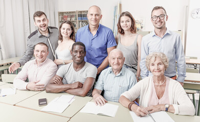 Obraz premium Portrait of group students different ages in modern classroom