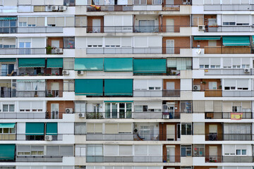 Typical facade of highly populated district in the urban area of the city where mostly elderly...