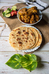 Paratha meaning an Indian style of bread made with flour along with meat condiments