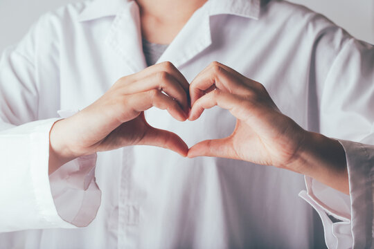  Doctor making hands in heart shape, heart health insurance,donation charity organ donor and world heart health day concept