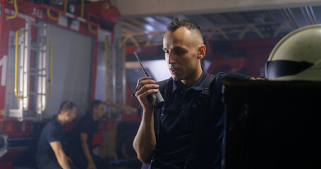 Firemen answering emergency call on station