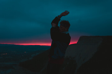 
The guy is dancing at sunset