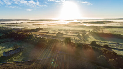 Aerial view of misty morning sunrise over rural county Kerry in the republic of Ireland.