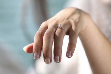 Diamond engagement ring on hand