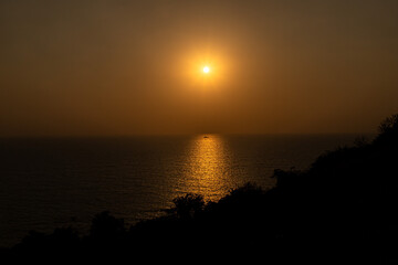 sunset at beach of  goa,india