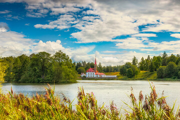 Summer landscape with a lake in the park, Priory Palace on the Black Lake in Gatchina Park, Russia