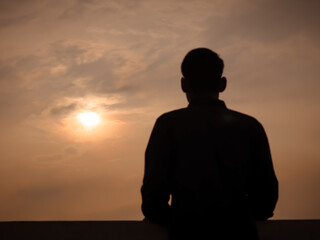 silhouette of a man in sunset