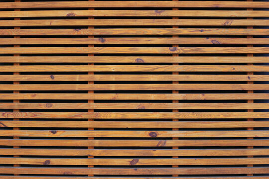 Wooden Brown Bars. Oak Slats On Wall, Decorative Border. Texture Of The Light Wood Boards Lie Horizontally. Wood Background