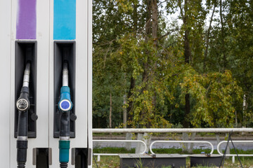 Car filling station. Filling nozzles at gas station.