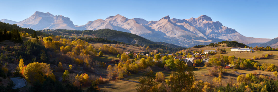 Panoramic Autumn view on the Devoluy Mountain Range (Obiou Peak) and the villages of Giers and Le Courtil. Hautes-Alpes. Alps, France