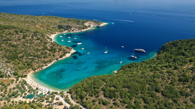 Aerial drone photo of turquoise heart shaped paradise sandy beach and bay of Sarakiniko a safe sail boat anchorage in Ithaki or Ithaca island, Ionian, Greece