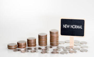 New normal concept and coins stack isolated on background. saving money. copy space for text .