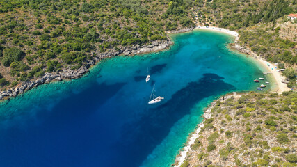 Aerial drone photo of turquoise paradise sandy beach and bay of Filatro a safe sail boat anchorage in Ithaki or Ithaca island, Ionian, Greece
