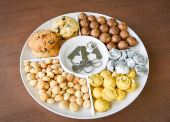 Set of macadamia nut packaging on tray plate natural high protein - cookies chocolate with macadamia nuts