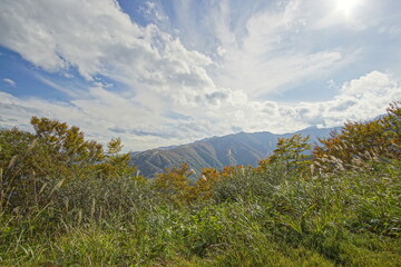 Majestic mountains landscape under blue sky with clouds in Japan