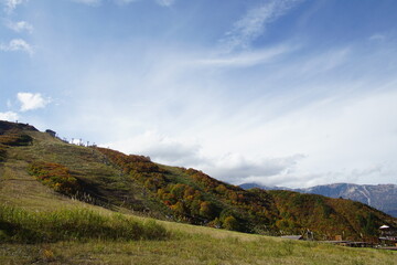 Majestic mountains landscape under blue sky with clouds in Japan