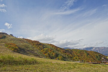Majestic mountains landscape under blue sky with clouds in Japan
