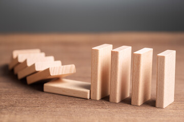 Unaffected Domino for Business Crisis Concept